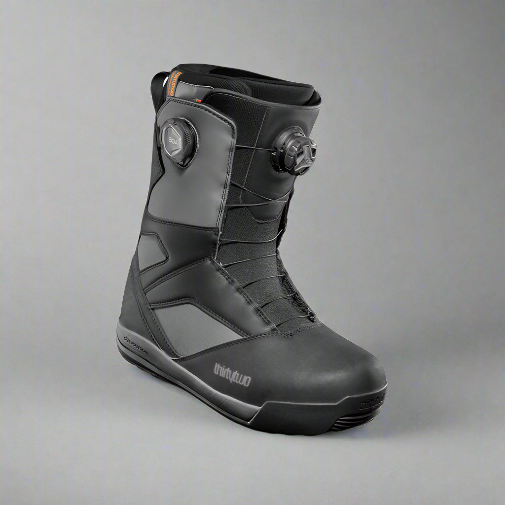 Black snowboard boot with visible brand logo on a white background