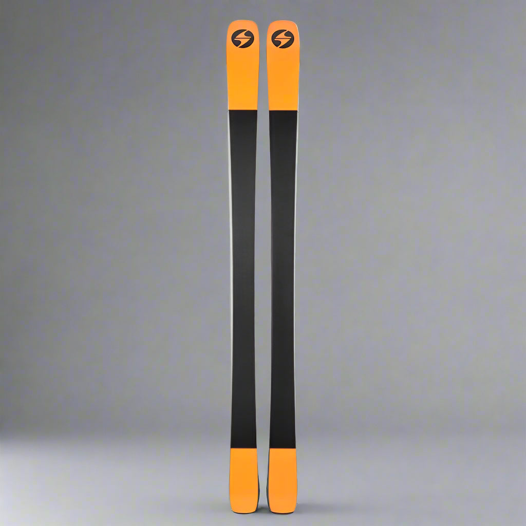 Pair of orange and black skis with a logo on a white background