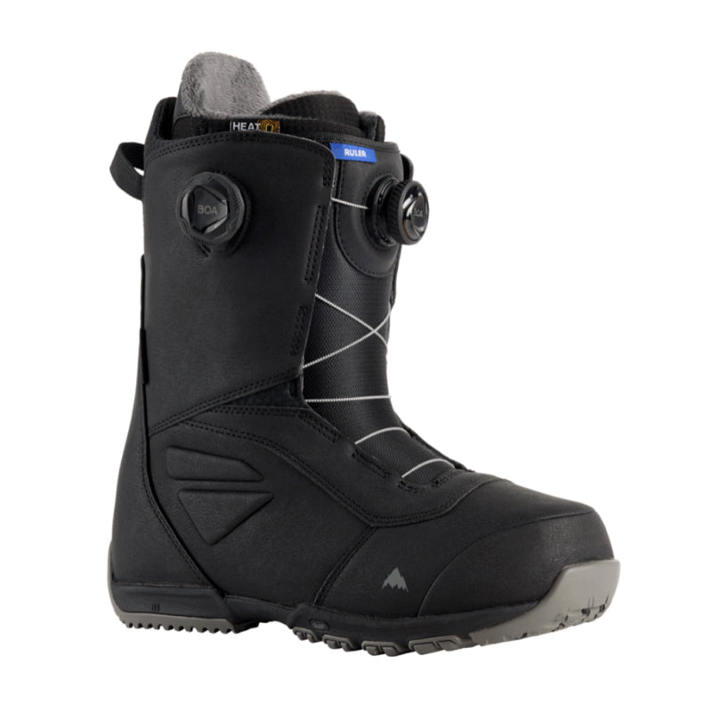 Black snowboard boot with gray sole on a white background