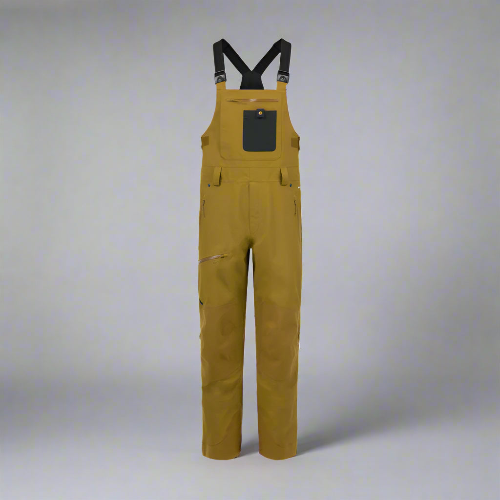 Brown bib overalls with black suspenders on a white background