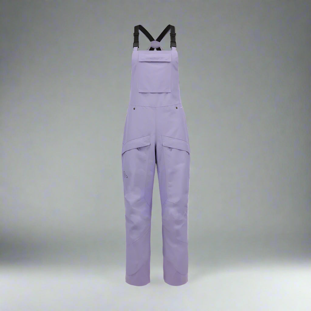 Purple bib overalls on a white background