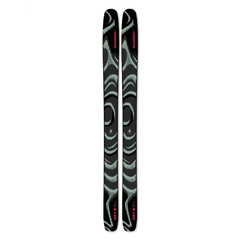 A pair of Salomon ski tips with a black base featuring mint green abstract wave patterns and pink brand lettering, shown vertically on a plain white background.