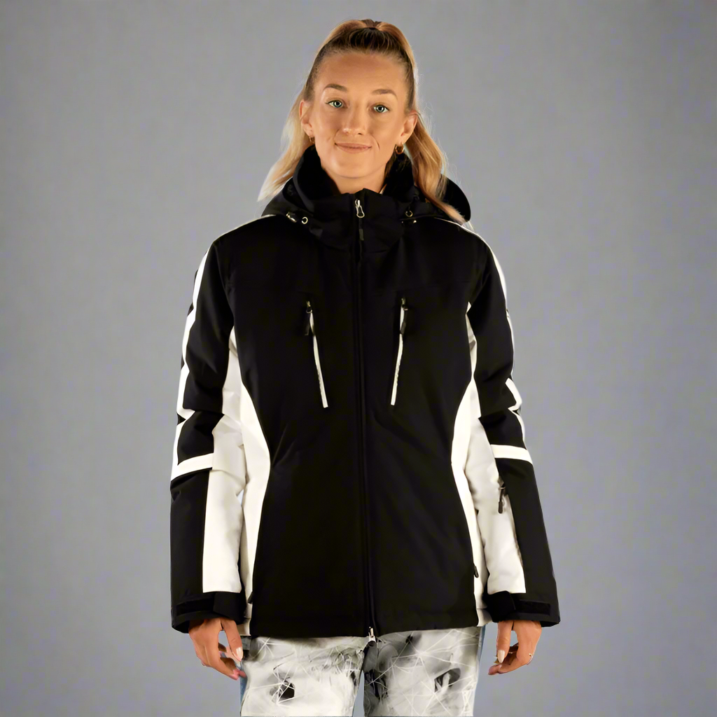 Person wearing a black and white jacket on a light gray background