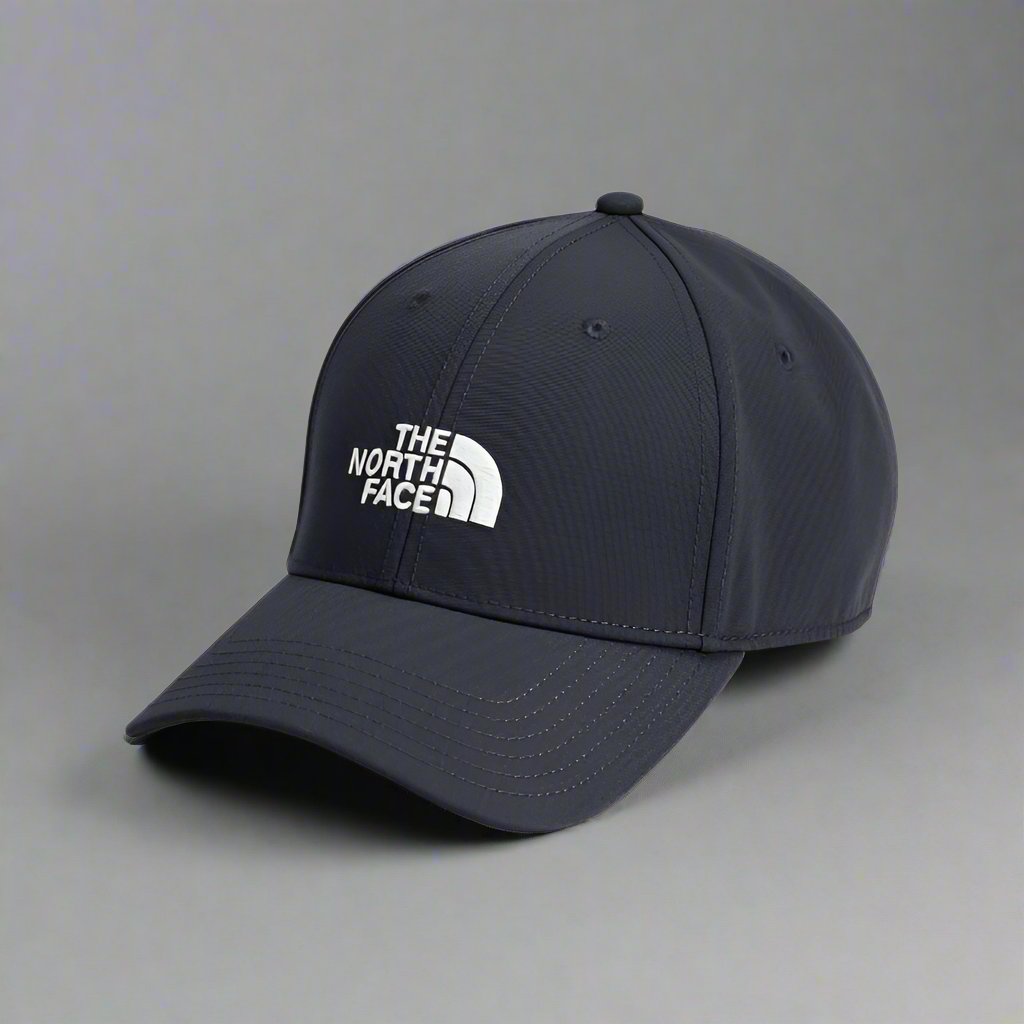 Navy blue cap with The North Face logo on a white background