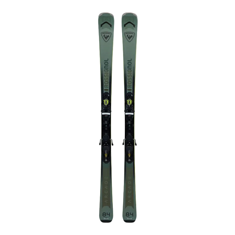 Pair of green skis with bindings on a light gray background