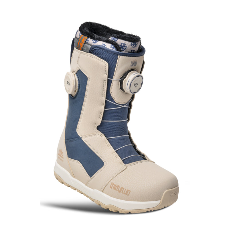 Beige and blue snowboard boot with brand logo on a white background