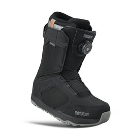 Black snow boot with visible brand logo on a white background
