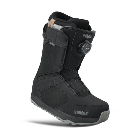 Black snow boot with visible brand logo on a white background