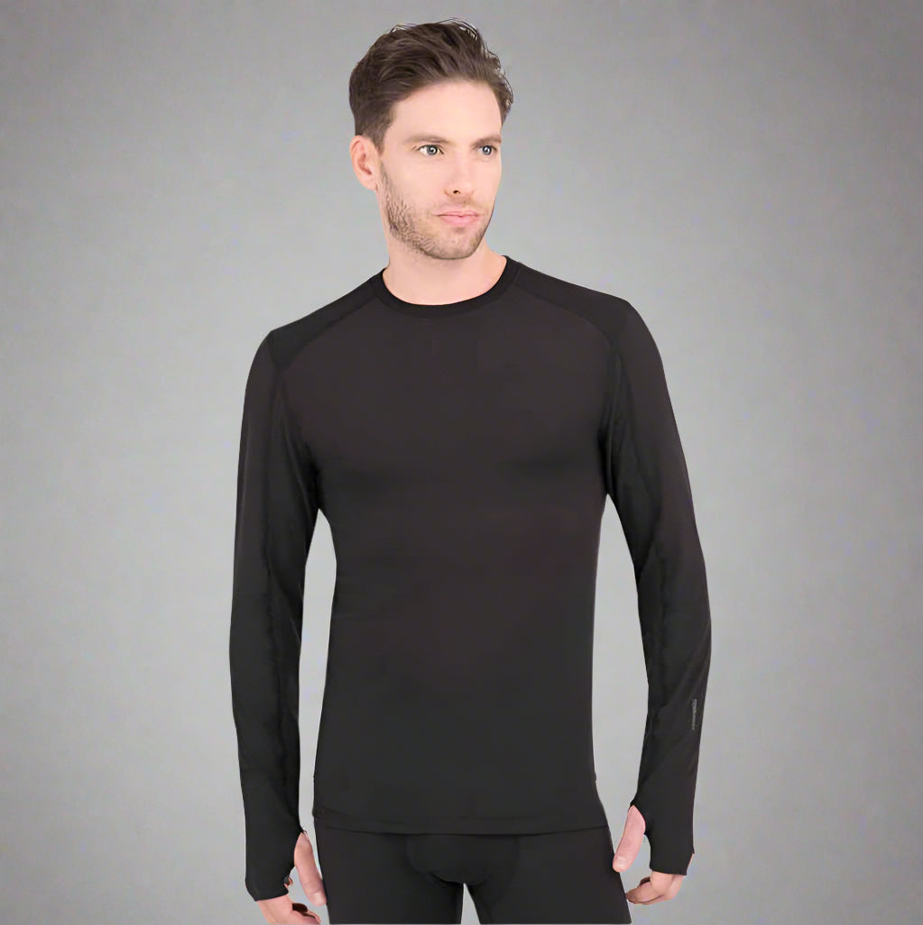 Man wearing a black long-sleeve shirt and black pants on a light gray background