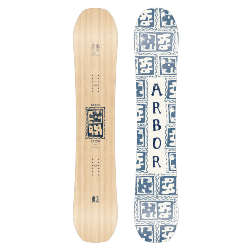 Two snowboards, one natural wood and one with blue geometric pattern, on a white background.