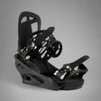 Black snowboard bindings on a white background