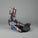 Multicolored snowboard binding on a textured surface with a neutral background