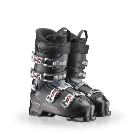 Black ski boots with silver buckles on a white background