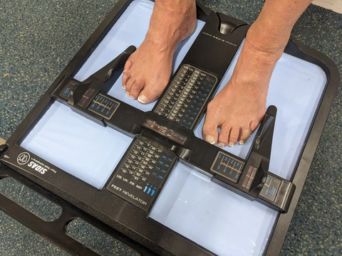 Foot and arch measurement during a custom insole fitting at Proctor Ski & Board