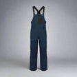 Navy blue bib overalls on a white background