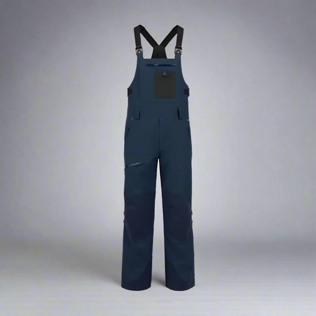Navy blue bib overalls on a white background