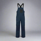 Navy blue bib overalls on a white background