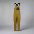 Brown bib overalls with black suspenders on a white background