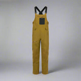 Brown bib overalls with black suspenders on a white background