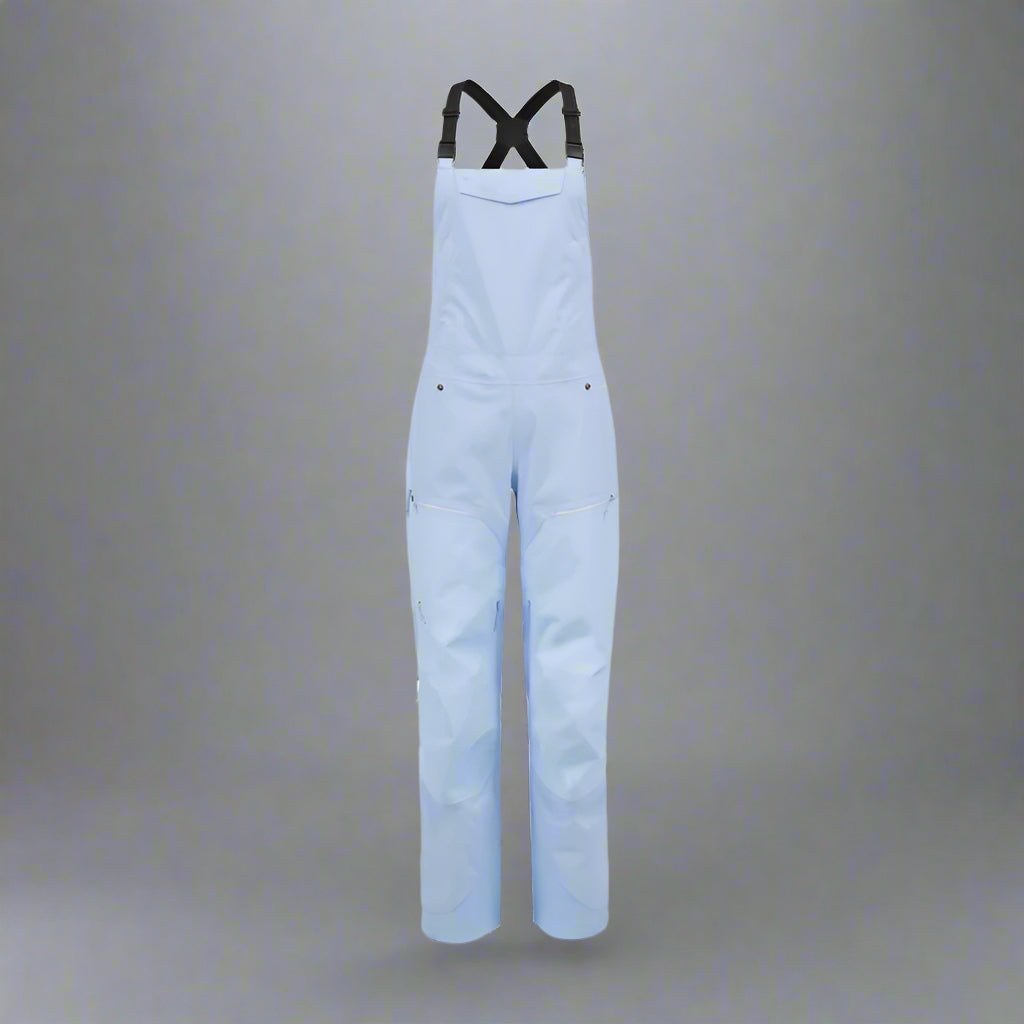 Light blue bib overalls on a white background