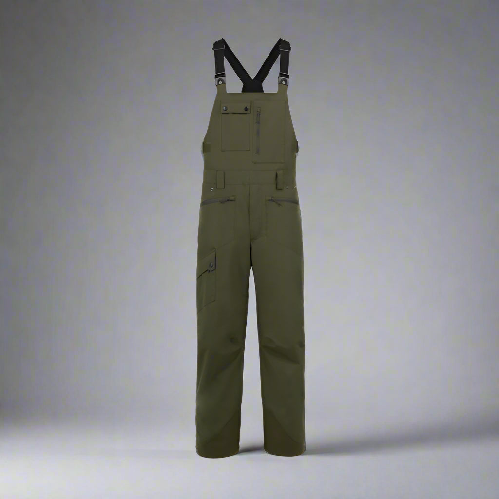 Green bib overalls with black straps on a white background