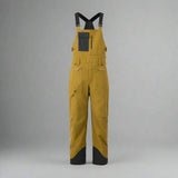 Yellow bib overalls with black accents on a white background