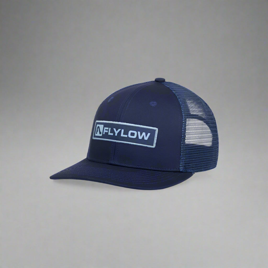 Navy blue mesh cap with Flylow logo on a white background