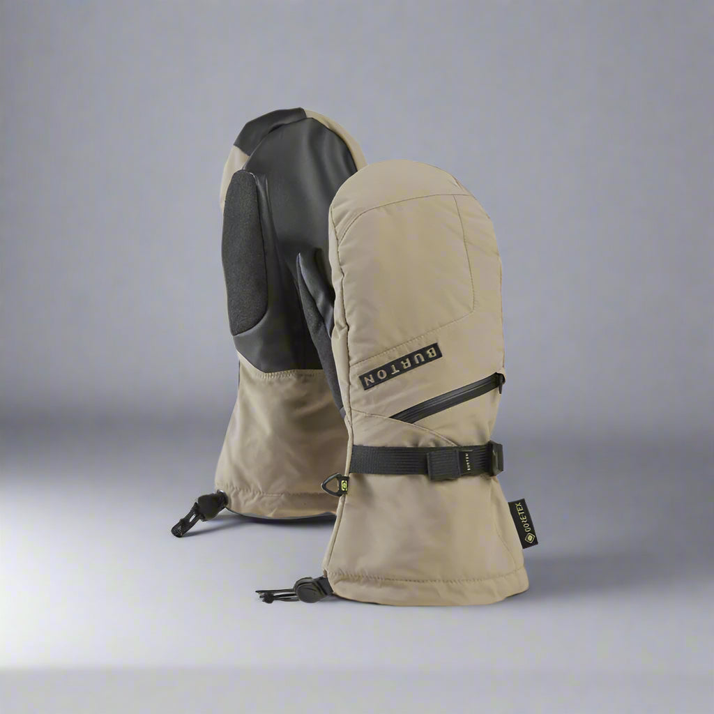 Pair of beige and black Burton mittens on a white background