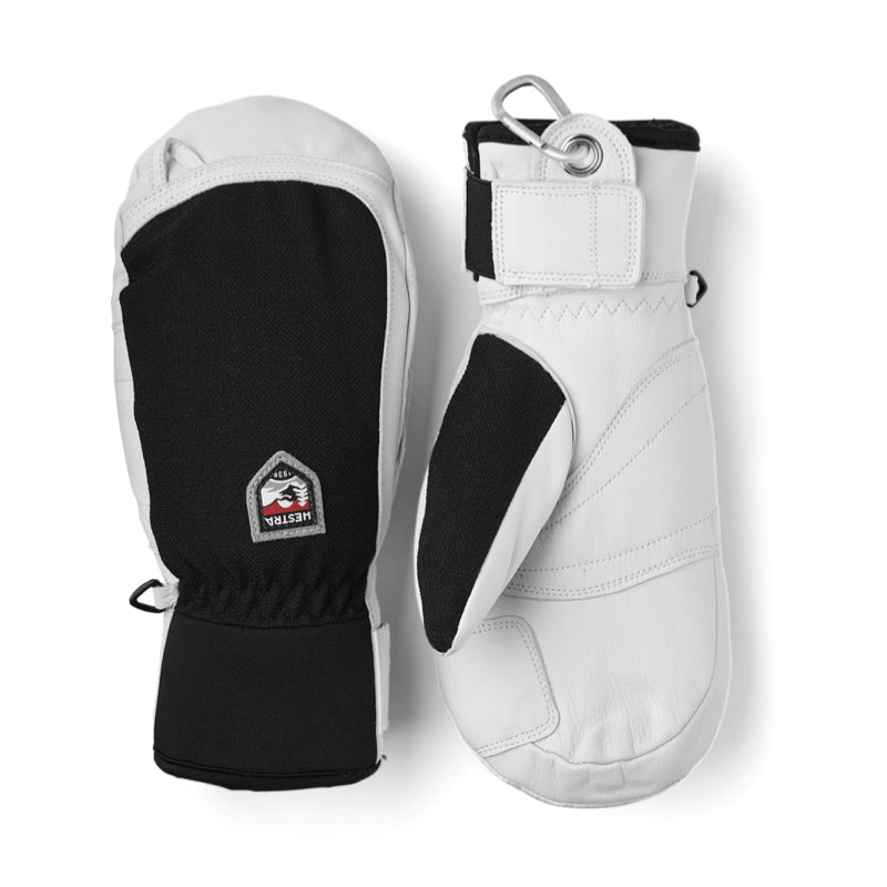 A pair of white and black winter gloves shown against a plain white background, displaying both the back with a Velcro strap and a logo patch, and the front with a black grip panel.