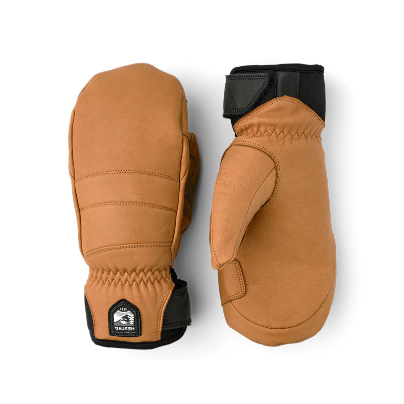 A pair of tan leather winter mittens with black trim and Velcro closures, displayed side-by-side on a white background.