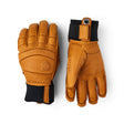 A pair of Jestra leather gloves in a warm tan/cognac brown color with black cuffs, shown from both the back and palm views on a white background.