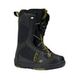 Black snowboard boot with green accents on a white background