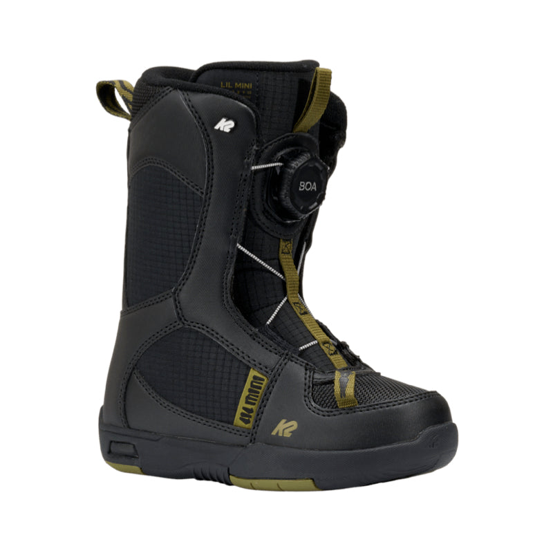 Black snowboard boot with green accents on a white background