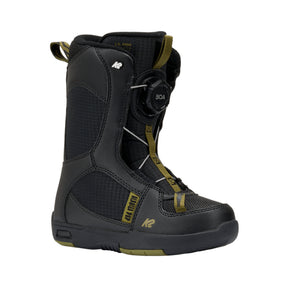 Black snowboard boot with green accents on a white background