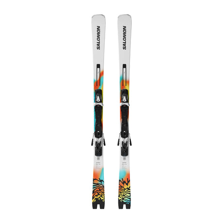 A pair of Salomon alpine skis with black bindings, featuring a white base with vibrant orange, yellow, and teal graphic patterns near the tips, shown against a plain white background.