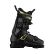 A Salomon ski boot in black with gold accents, featuring a dial closure system and a quick-release buckle, shown from a side profile on a white background.