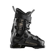 Salomon ski boot in black with gold lettering, featuring a dial closure system and quick-release buckles, shown from a side profile on a white background.