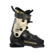Salomon Speed Pro ski boot in black and beige with gold accents, featuring dual BOA dials and a quick-release buckle system, shown against a plain white background.