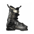 Salomon ski boot in black with gold branding and camouflage-patterned buckles, shown from a side profile on a white background.