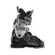 Salomon ski boot in black and silver with green accents, featuring a dial closure system and quick-release buckles, shown from a side profile on a white background.
