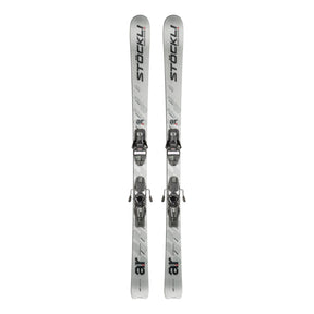 A pair of silver and white ski boots with black branding, shown vertically side-by-side against a plain white background.