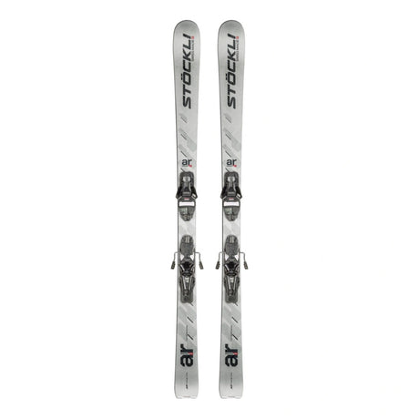 A pair of silver and white ski boots with black branding, shown vertically side-by-side against a plain white background.