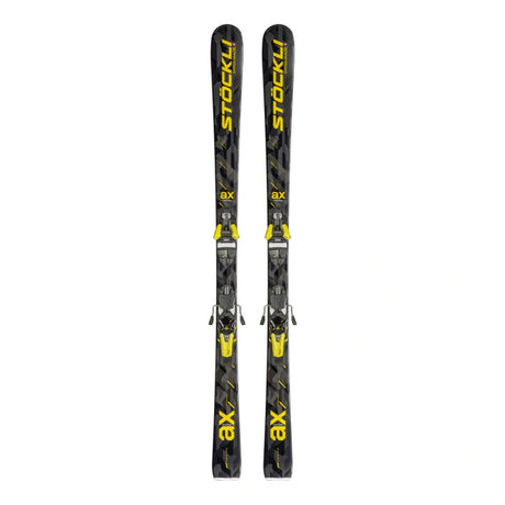 A pair of black Stockli ax ski boots with bright yellow branding and accents, shown vertically against a plain white background.