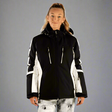 Person wearing a black and white jacket on a light gray background