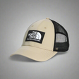 Beige and black cap with The North Face logo on a white background