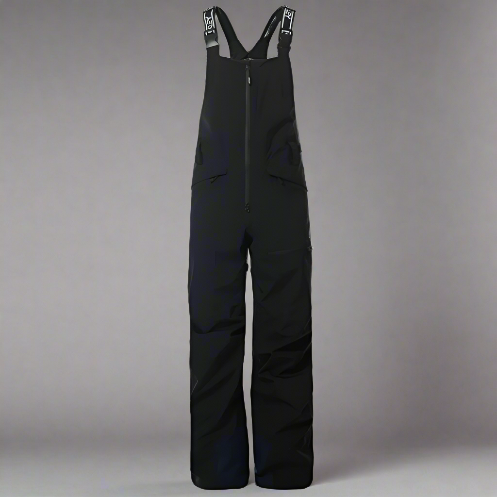 Black bib overalls on a light gray background