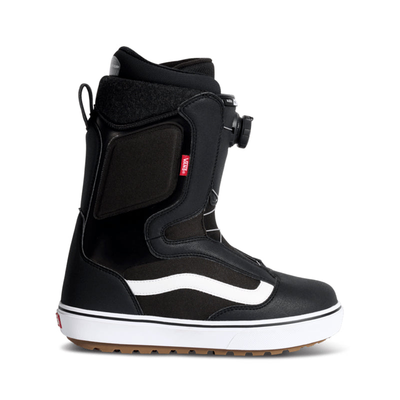Black snowboard boot with white sole on a white background