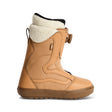 Tan winter boot with white fur lining on a white background