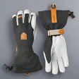 Pair of gloves with Hestra logo on a grey background
