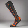 Black and orange compression sock on a white background